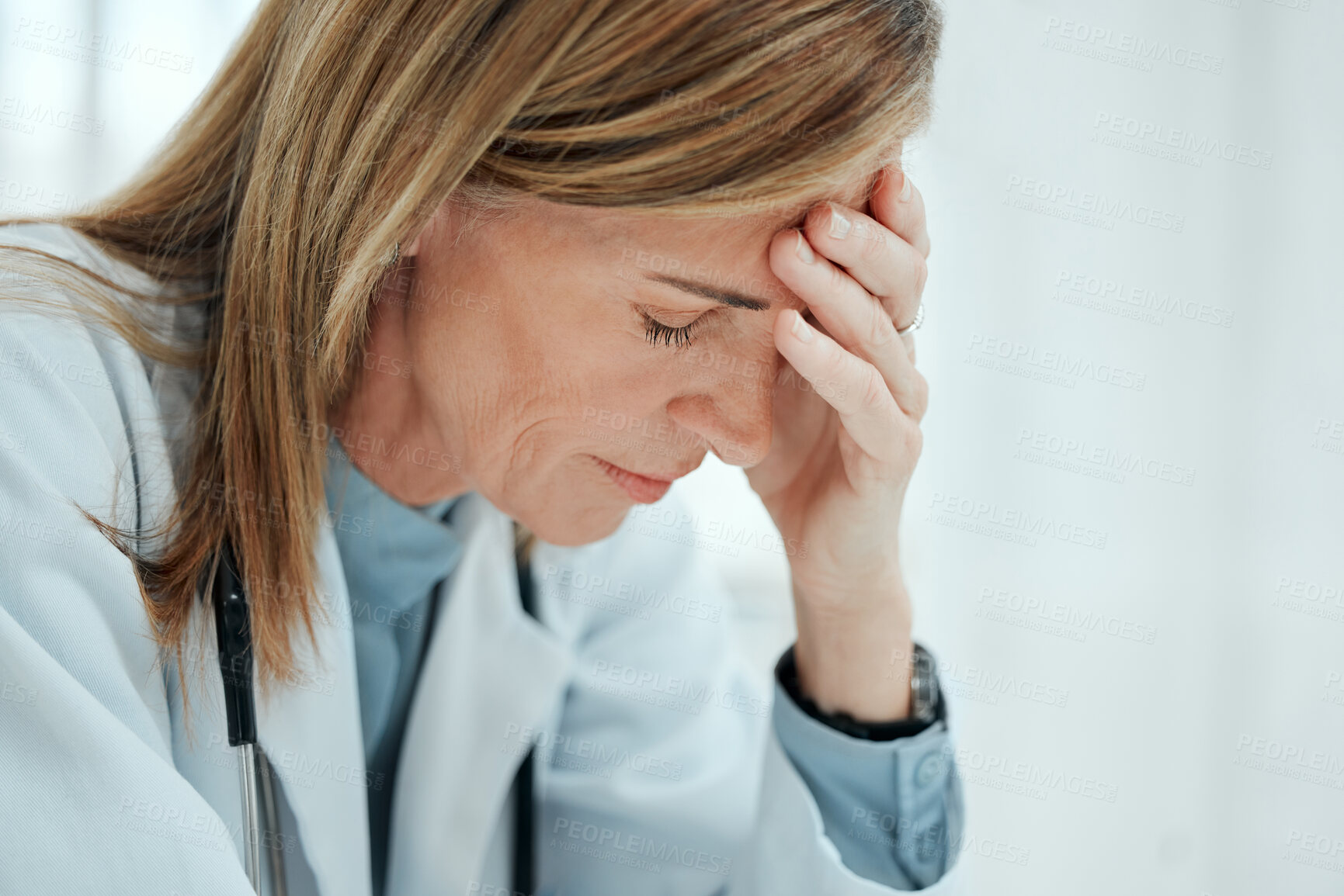 Buy stock photo Stress, woman and doctor with headache for fail, surgery mistake or loss in clinic. Sick, migraine or tired medical professional with burnout, depression or anxiety for healthcare crisis or challenge