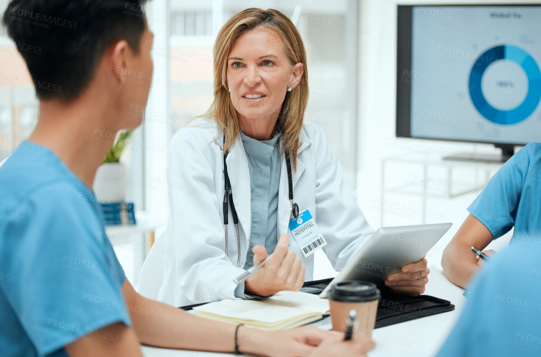 Buy stock photo Doctor, meeting and medical students on tablet with group for healthcare, review or feedback. People, talking and technology in discussion for teamwork, staff and internship in clinic or hospital