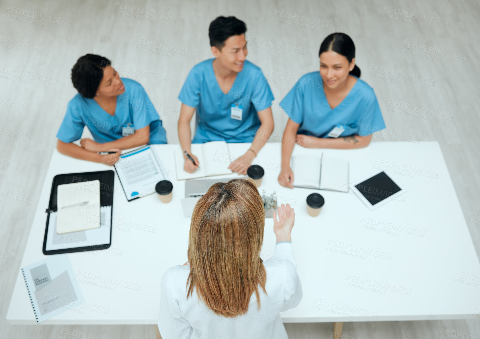 Buy stock photo Coaching, medical or development with doctor and nurses in hospital boardroom for seminar or training. Coffee, documents and workshop with professional healthcare people in clinic for meeting