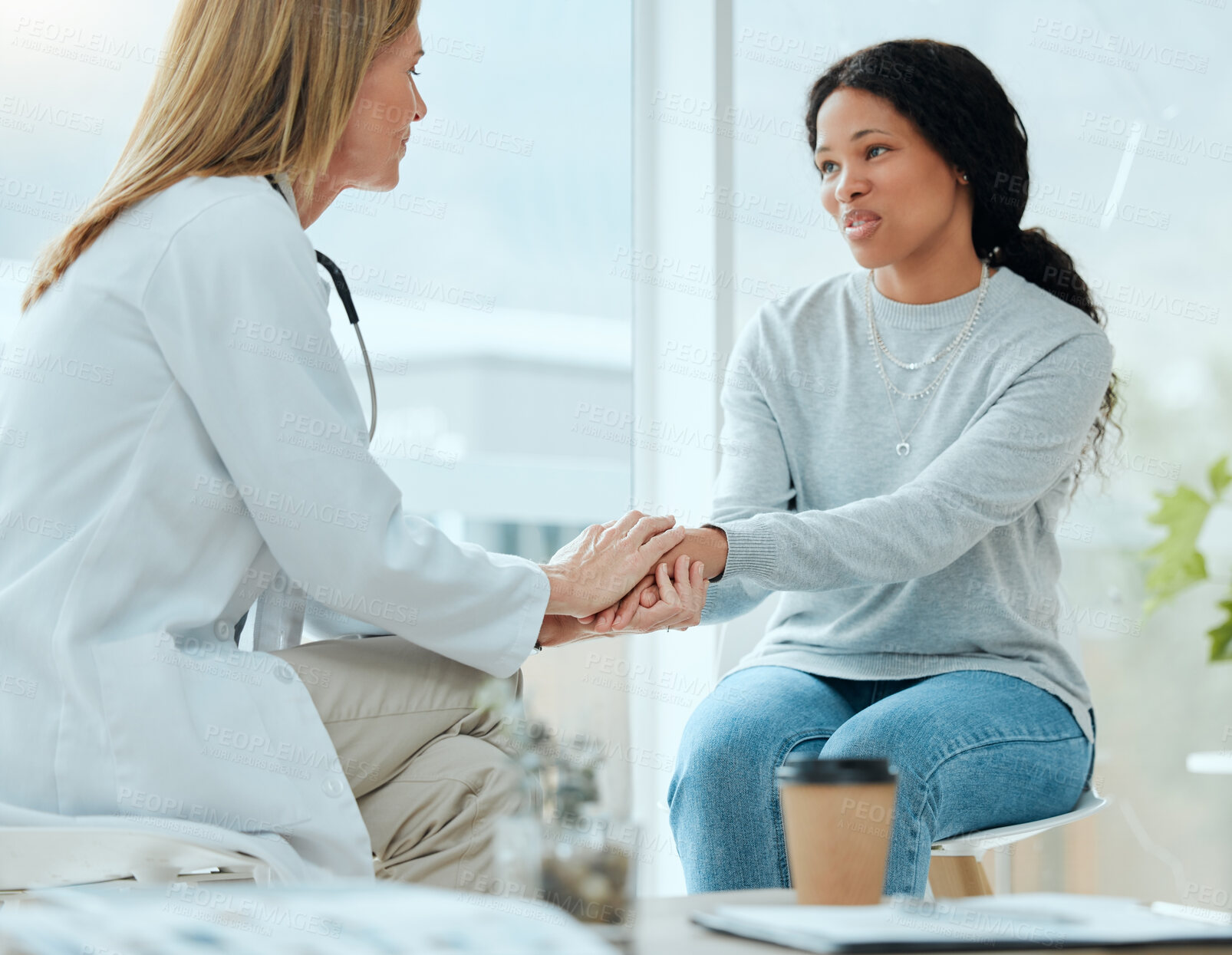 Buy stock photo Shot of a mature doctor and her patient discussing her latest results in the waiting room