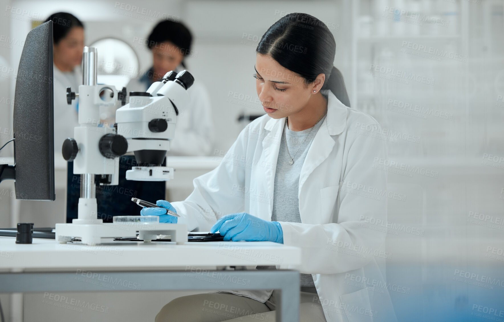 Buy stock photo Scientist, study and woman with microscope in lab for medical experiment, pathogen and development. Science, pharmaceutical and biotech with sample for Mpox vaccine, innovation and epidemiology test