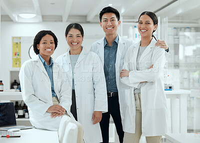 Buy stock photo Shot of a proud team of scientists together in their lab