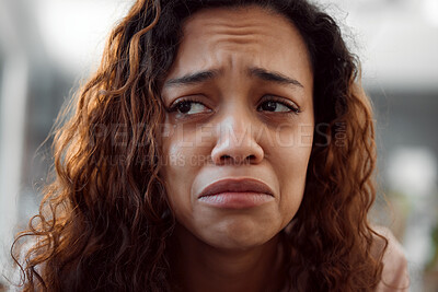 Buy stock photo Shot of a young female experiencing internal turmoil at home