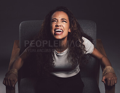 Buy stock photo Woman, hostage and screaming with abuse, fear and anxiety for mental health or bipolar disorder. Female person, struggle and chair in crying for help in distress, danger or horror on dark background