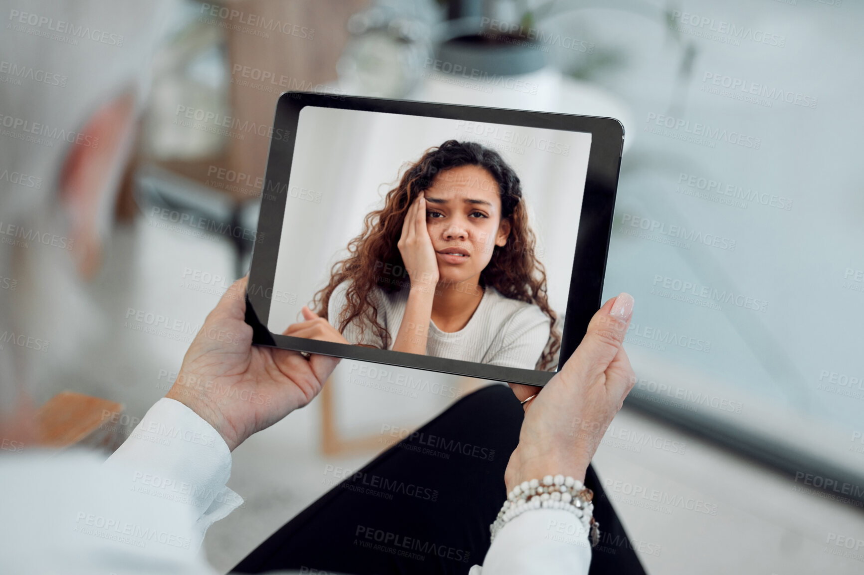 Buy stock photo Tablet, sad and therapy for person, online and help for mental health, telehealth and anxiety in clinic. Hands, emotional and explaining to psychologist, digital and treatment for bipolar and app