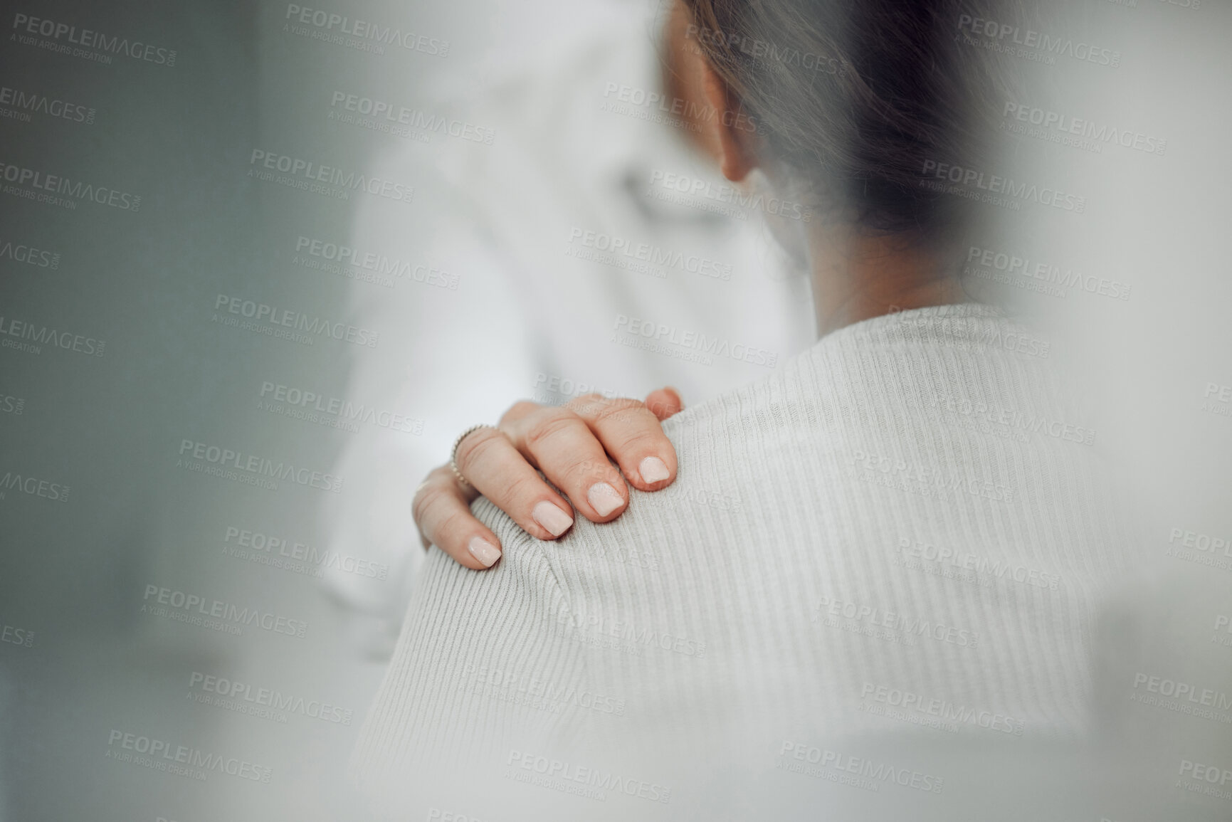 Buy stock photo Cropped shot of an unrecognisable psychologist sitting and comforting her patient during a consultation