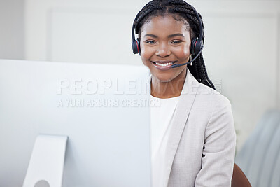 Buy stock photo Shot of a young african woman working on her PC in a call center