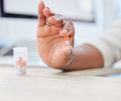 Buy stock photo Shot of a businesswoman holding a capsule