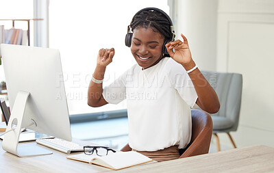 Buy stock photo Dance, headphones and woman on computer, office or workplace for mental health, wellness and listening. Happy african person working on desktop pc and dancing to music, celebration and job or career