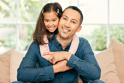 Buy stock photo Shot of a father and daughter bonding on the sofa at home