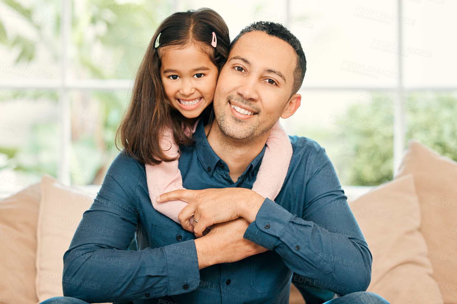 Buy stock photo Shot of a father and daughter bonding on the sofa at home