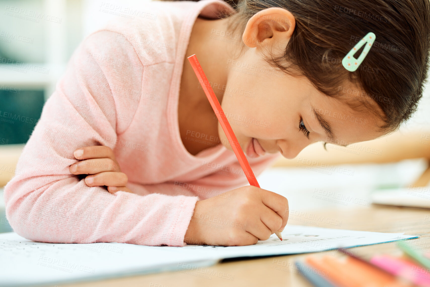 Buy stock photo Drawing, learning and girl with color pencil for creative lesson, motor skills and child development. Happy, home and young kid with crayons for education, fun activity and writing for homework