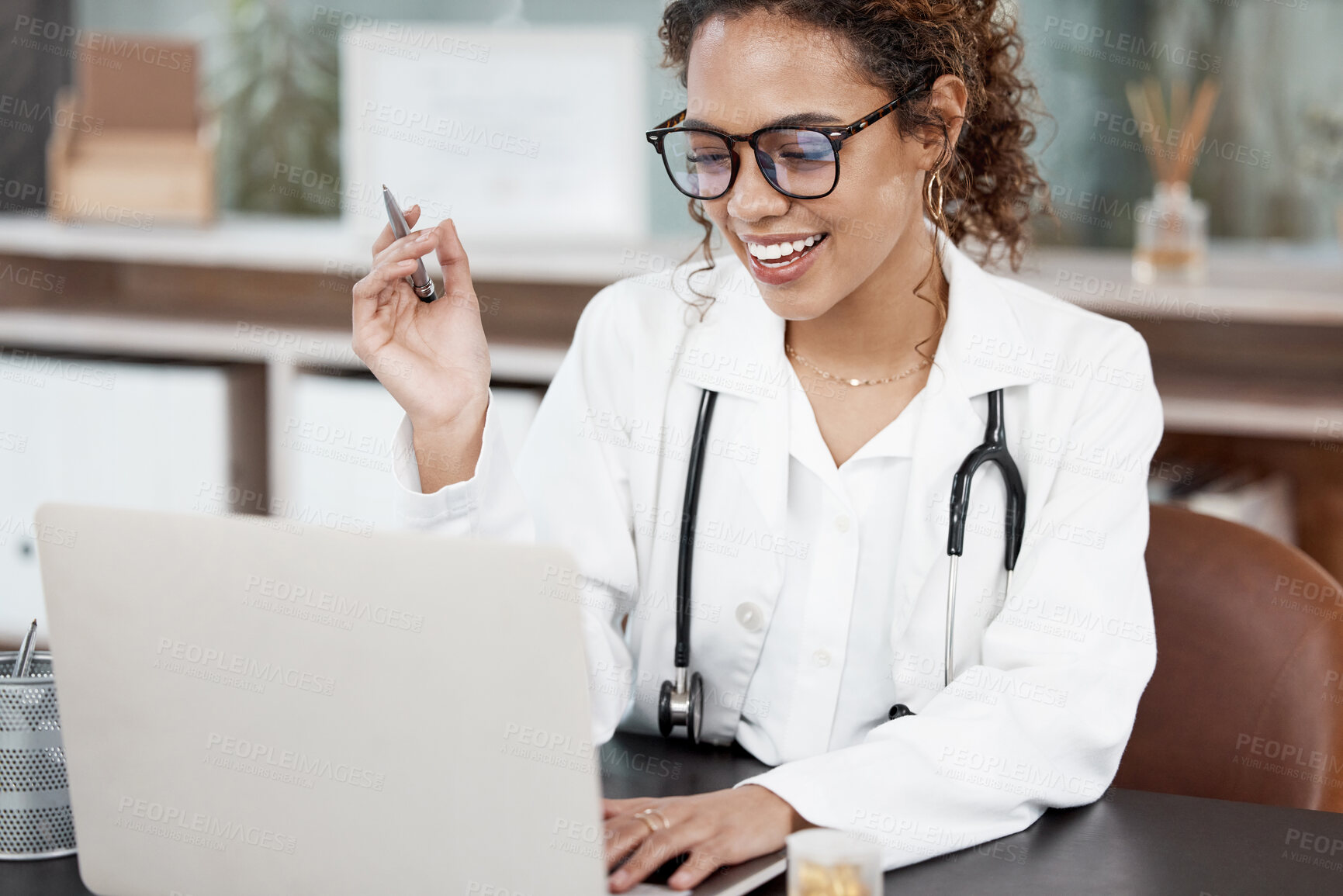 Buy stock photo Female doctor, video call and laptop in office with smile for meeting with remote collaboration for consult. Woman, conference and virtual examination with telehealth or appointment schedule in Spain