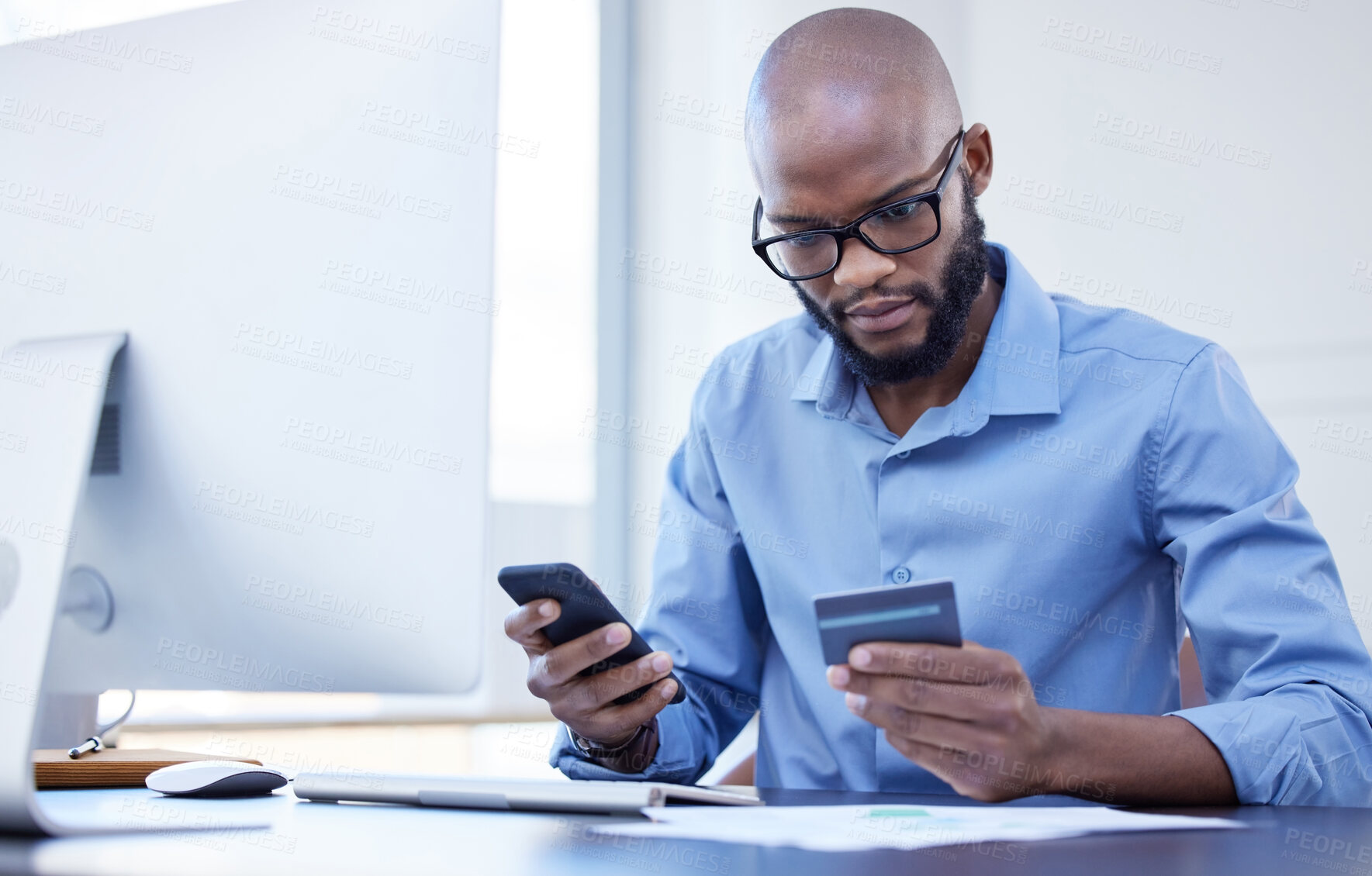 Buy stock photo Credit card, business and black man with mobile at desk in office for online banking, ecommerce or payment. Corporate, professional and male employee with smartphone for fintech, bills or transaction