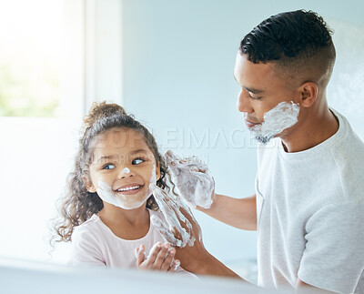 Buy stock photo Playful, child and dad with shaving in bathroom for cleaning, hygiene or morning routine by mirror. Help, family and man with girl at home for skincare support, development or bonding in apartment