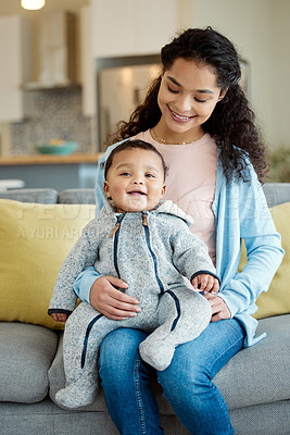 Buy stock photo Shot of a young mother bonding with her baby boy on the sofa at home