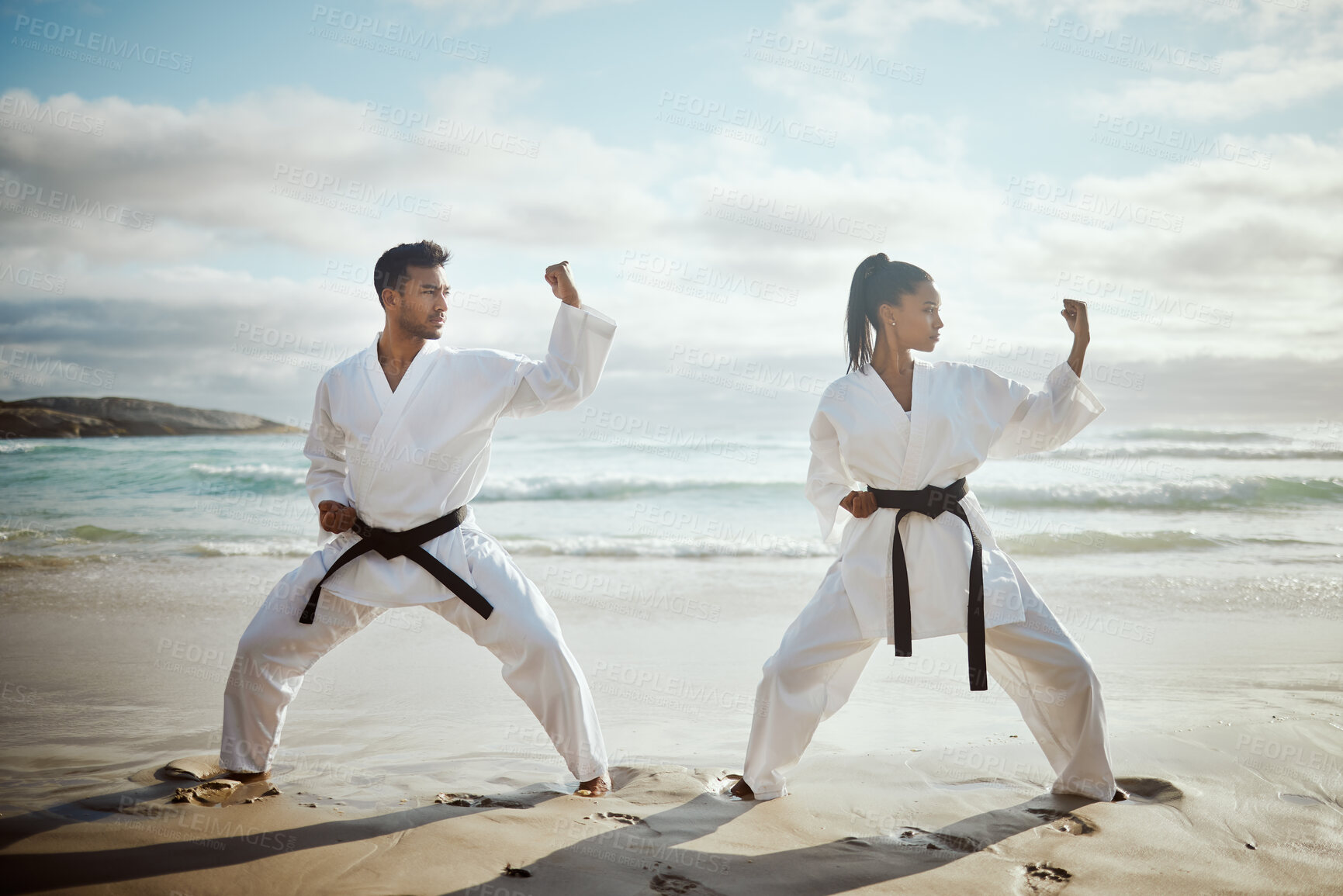 Buy stock photo Sport, karate and team at beach for training, taekwondo or performance outdoor with student. Ocean, martial arts and people practice for fitness, exercise or workout with warrior or master at lesson