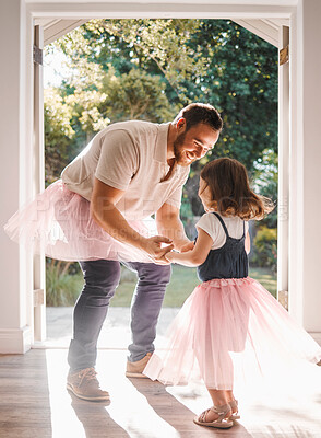 Buy stock photo Shot of an adorable young girl and her father dancing together at home