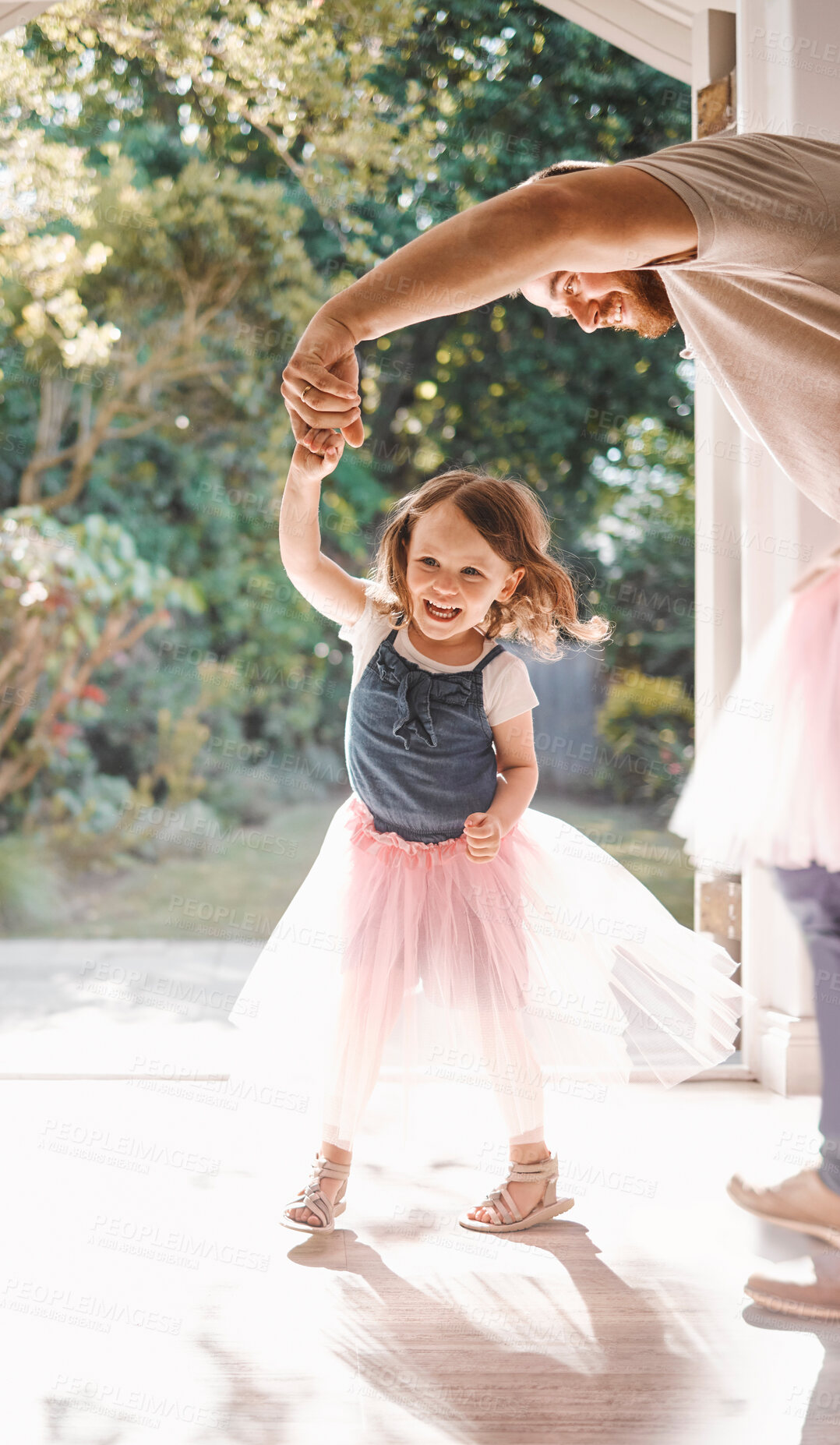 Buy stock photo Shot of an adorable young girl and her father dancing together at home