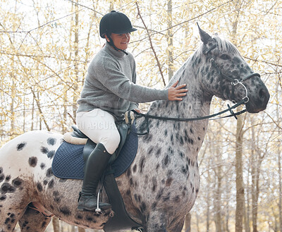 Buy stock photo Young, woman and touching horse in nature for exercise, sports and adventure or freedom in forest. Equestrian, female person and animal for workout, training and wellness in countryside or woods