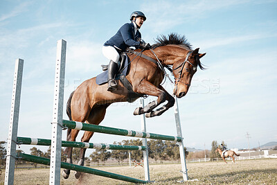 Buy stock photo Show jumping, woman and horse on ranch or farm for fitness, training and event or competition. Sport, animal and movement in countryside for course, dressage and performance in arena in Texas 