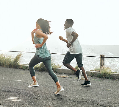 Buy stock photo Back, fitness and ocean road with couple running together for challenge, exercise or competition. Cardio, training or workout with man and woman on asphalt street for health, sports or wellness