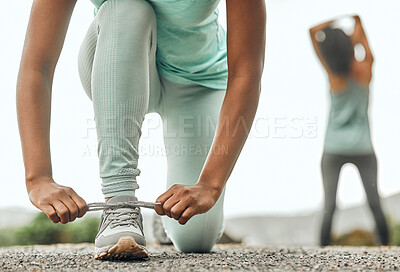 Buy stock photo Shoes, sports and a woman runner tying laces outdoor during an exercise workout for endurance or cardio. Fitness, health and training with a female athlete fastening footwear in preparation of a run
