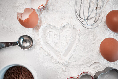 Buy stock photo Shot of baking powder dusted into a heart shape on a countertop after baking