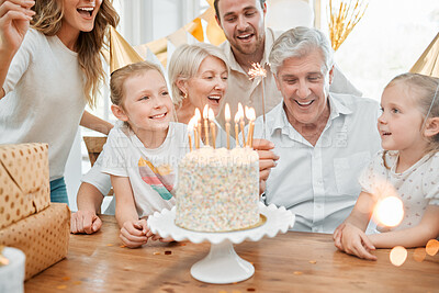 Buy stock photo Shot of a happy family celebrating a birthday at home