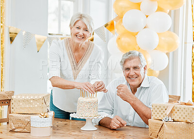 Buy stock photo Shot of a happy senior couple celebrating a birthday at home