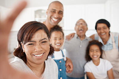 Buy stock photo Shot of a family taking selfies together