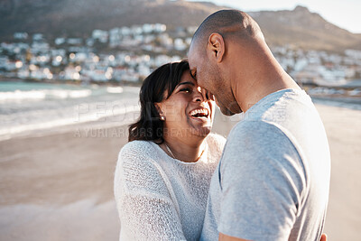 Buy stock photo Shot of a young couple spending time at the beach