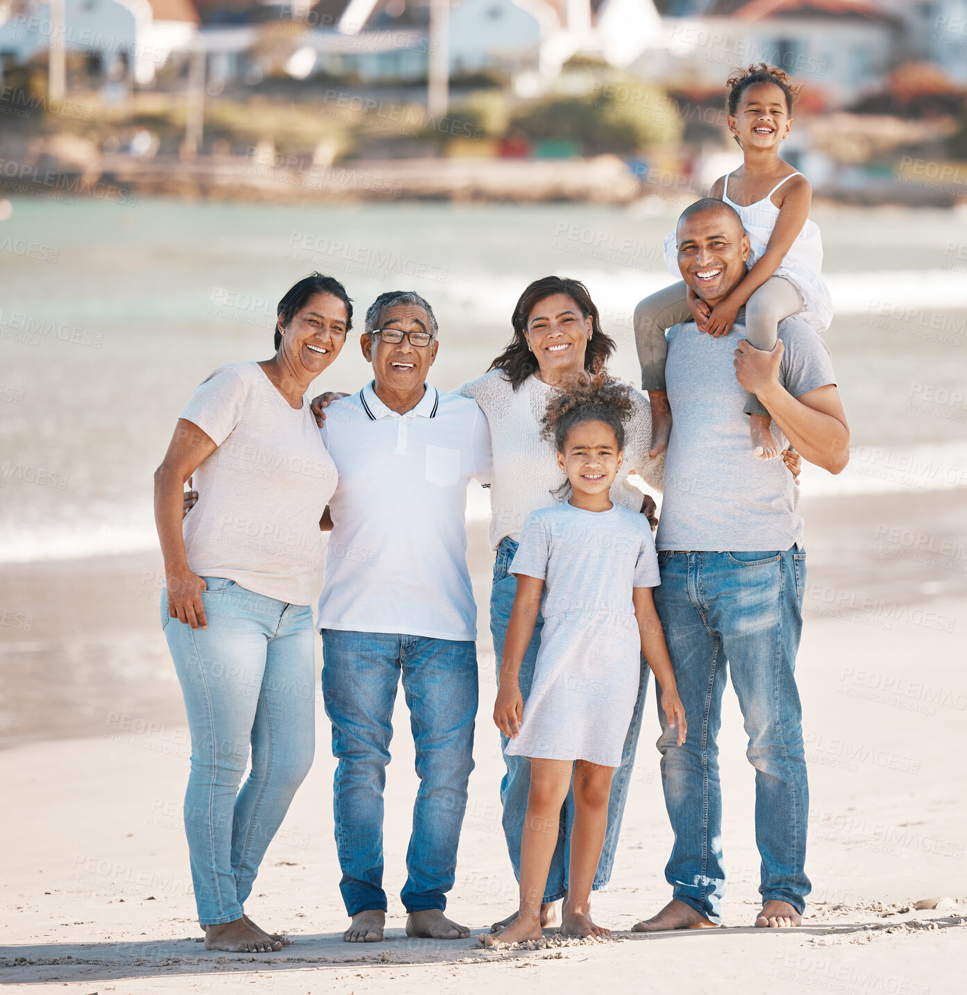 Buy stock photo Beach, portrait and family together in embrace with smile, love and bonding on travel vacation. Men, women and children with parents, grandparents and solidarity on happy holiday adventure in Mexico