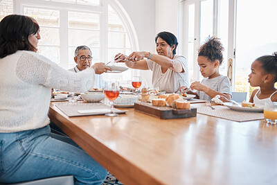 Buy stock photo Family, home and dining table for happy meal, social gathering and brunch sharing lunch or grandparents. People, love and woman serving or gourmet nutrition, apartment and together with healthy dish