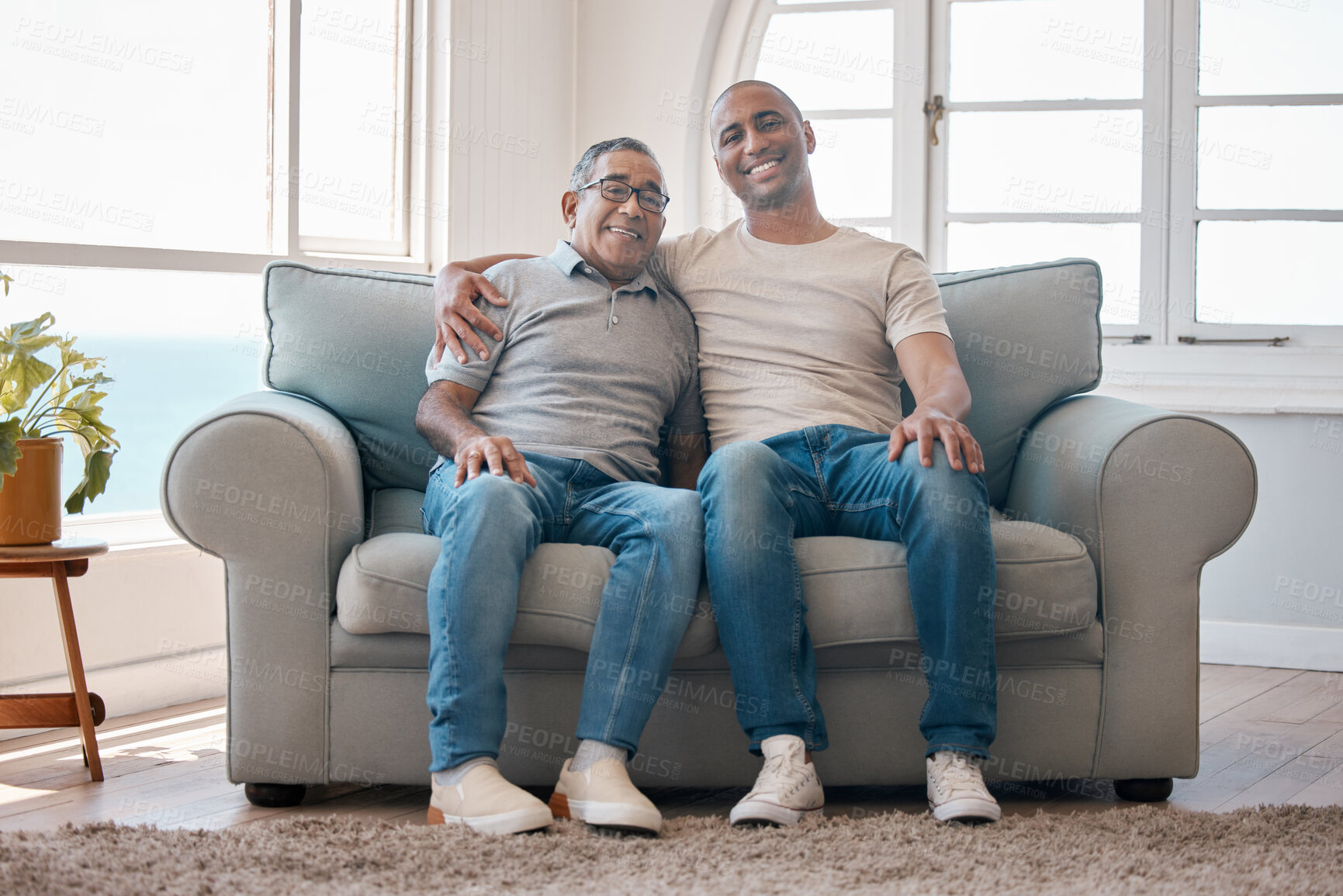 Buy stock photo Shot of a young man spending time with his father