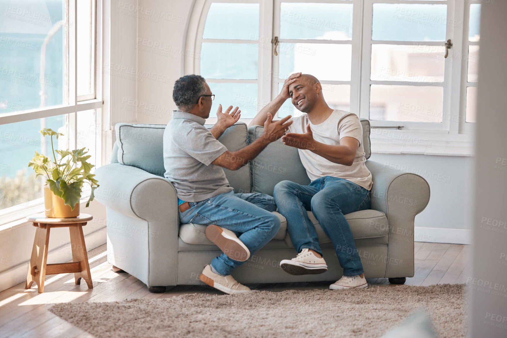 Buy stock photo Conversation, smile or visit with man and father on sofa in living room of home together for bonding. Family, happy and love with elderly person talking to son in apartment to relax for retirement