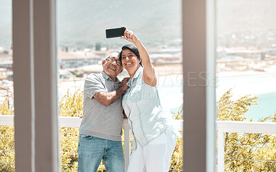 Buy stock photo Shot of a senior couple taking a selfie in nature