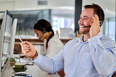 Buy stock photo Shot of two business people working together in a call center