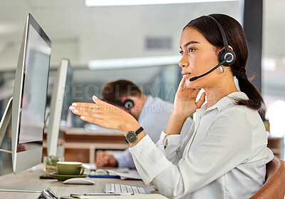 Buy stock photo Shot of a young businesswoman helping customers in a call center