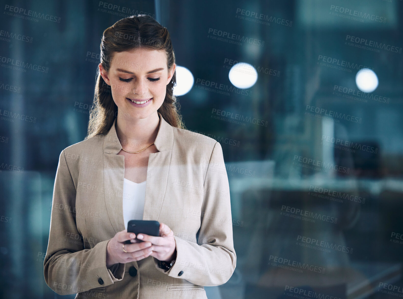 Buy stock photo Phone, night or happy businesswoman on social media texting or typing an email in online conversation. Office, mobile app or girl employee on web chat for blog post or networking on late break at job