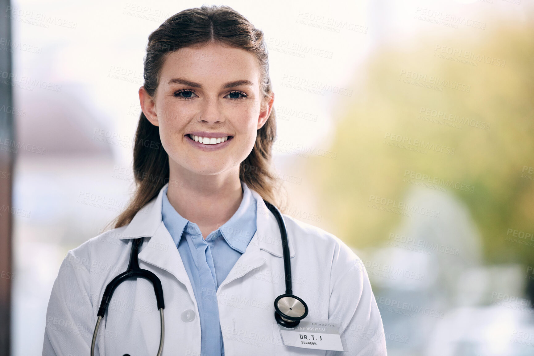 Buy stock photo Portrait, happy woman or proud doctor in hospital to help with confidence, smile or positive mindset. Face, mockup or friendly medical healthcare professional smiling with nursing success in clinic