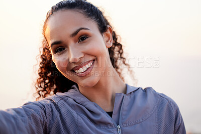 Buy stock photo Portrait of a beautiful young woman taking a break during her morning workout outside