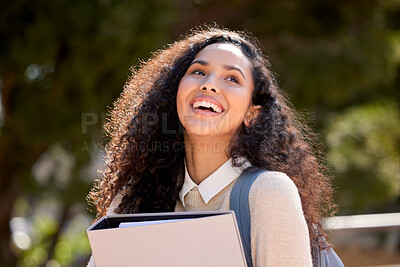 Buy stock photo Shot of an attractive young female student standing outside on campus