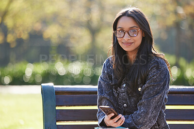 Buy stock photo Portrait, smile and girl on bench, smartphone and relax with social media, internet and connection. Face, person and student in park, cellphone or university with mobile user, website info or message