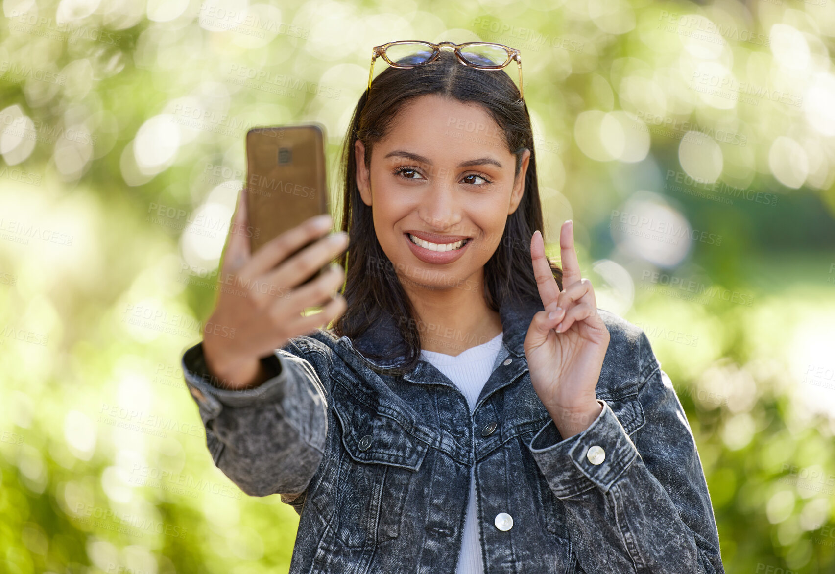 Buy stock photo Young woman, selfie and smile outdoor in park for social media, internet sharing and memories. Happy, female person or student in nature with technology for communication, contact and online post