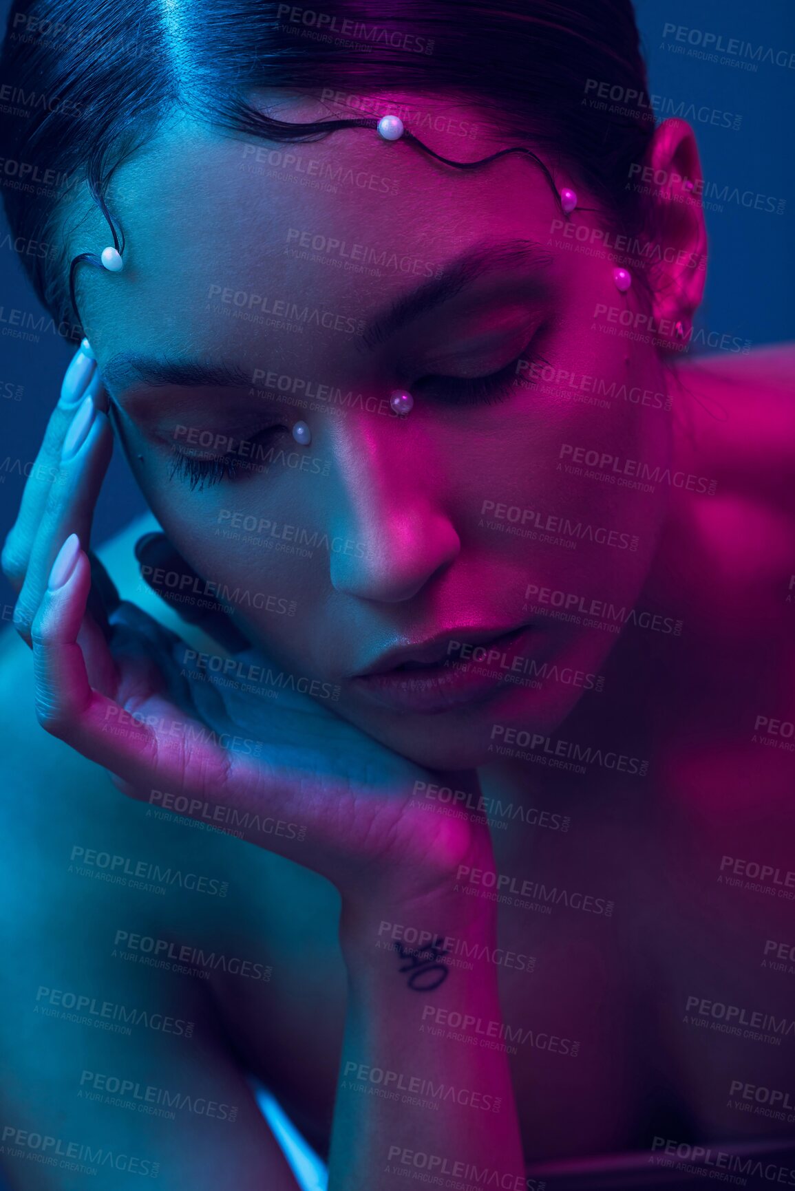 Buy stock photo Beauty, neon lights and woman with cosmetics, artistic or creativity against a blue studio background. Female person, girl or model with makeup, skincare or art with wellness, dermatology or colorful