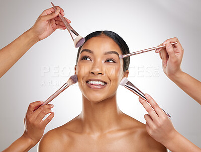 Buy stock photo Happy woman, makeup and hands with brush in studio with pride, cosmetics and application for beauty. Female person, thinking and creative for artist, glow and face by background for touch up 