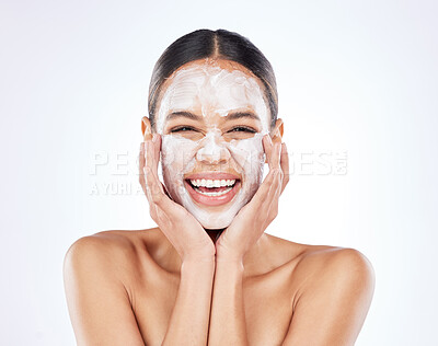 Buy stock photo Shot of a young woman posing against a studio background while wearing a face mask