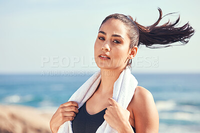 Buy stock photo Shot of a young woman taking a break during a workout