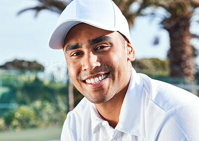 Buy stock photo Shot of a handsome young man standing alone during tennis practice